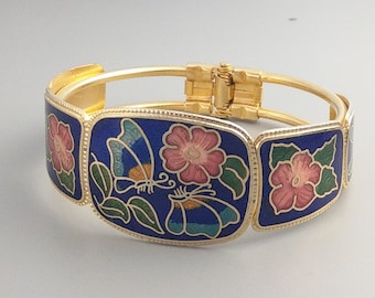 Pulsera de brazalete de esmalte azul con estampado floral y mariposa