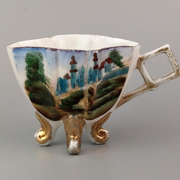 Antique Four footed teacup with painted Castle scene