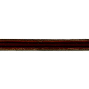 May include: A close-up of a brown wooden dowel rod with three grooves running along its length.
