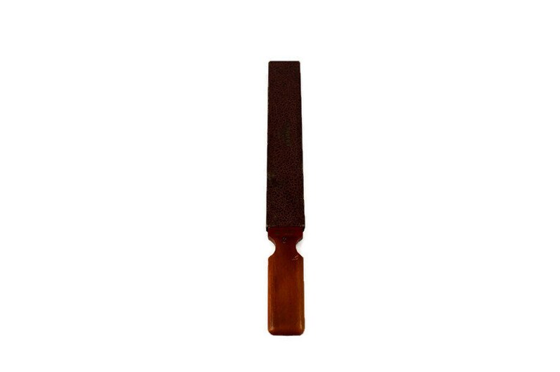 May include: A brown and black metal file with a wooden handle.