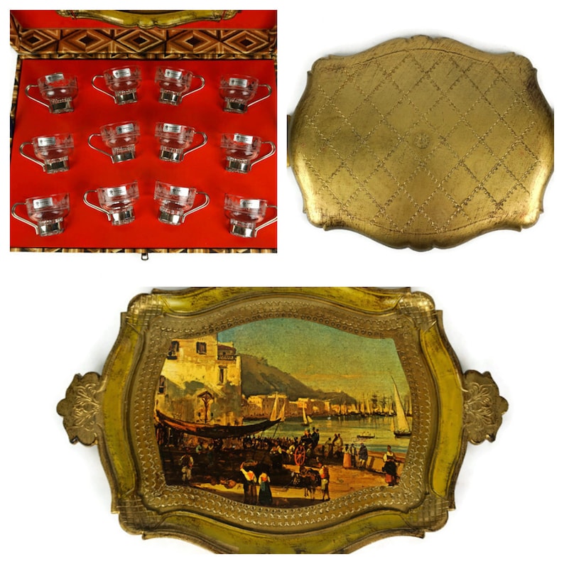 May include: A set of 12 clear glass cups with gold rims, displayed in a wooden box with a red velvet lining. The box is open and the cups are arranged in rows.