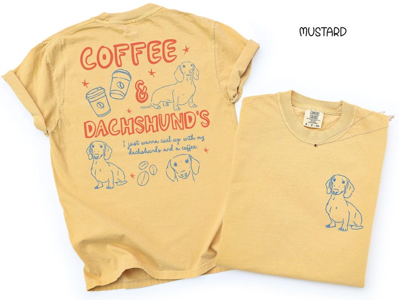 May include: Mustard-colored t-shirts with dachshund and coffee-themed graphics. One shirt features a large design on the back with text and illustrations, while the other has a small dachshund graphic on the front pocket.