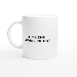 A slime draws near! - Dragon Quest Video Game Quote Nintendo NES White 11oz Ceramic Mug