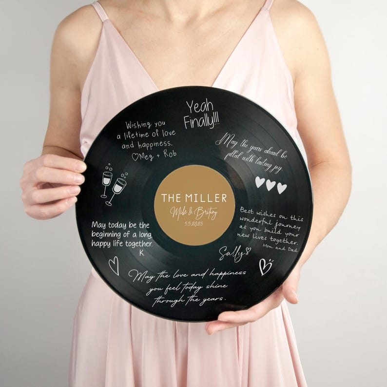 May include: Black vinyl record with white text wishing a couple a lifetime of love and happiness. The record has a gold label with the text "The Miller" and the date "5.5.2025".