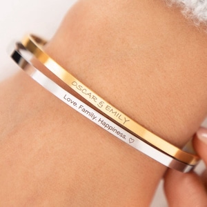 gold and silver bracelets on wrist