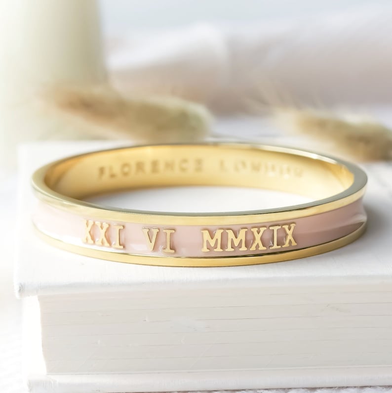 Pink bangle showing roman numerals