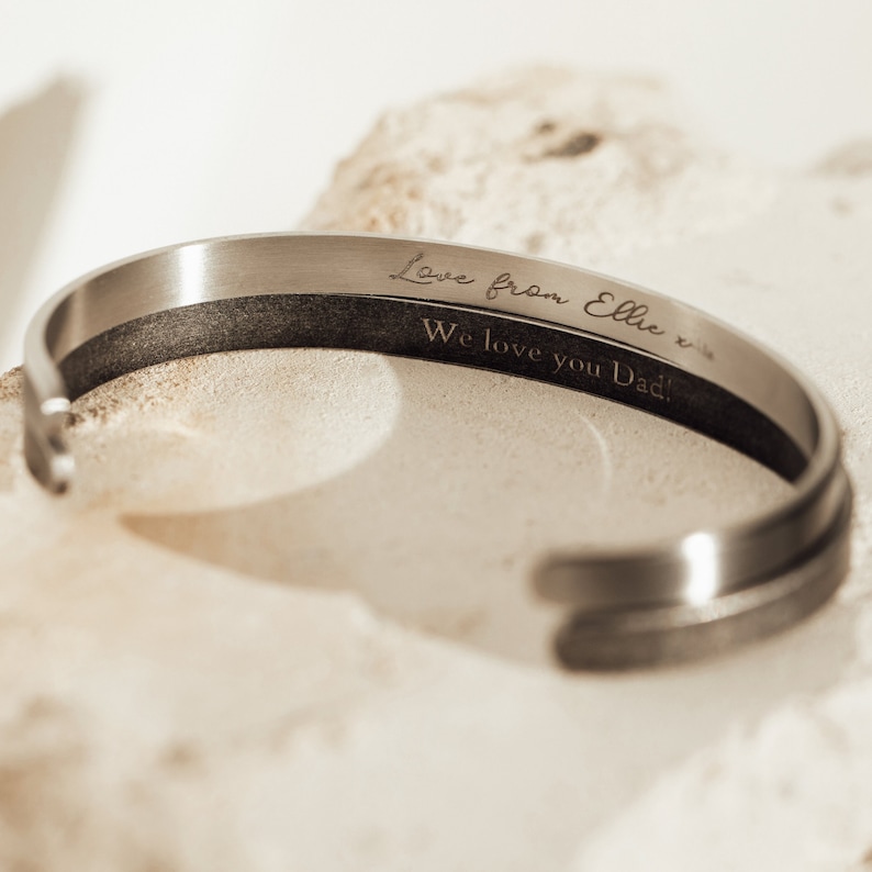 May include: Silver bracelet with an engraved message: "Love from Ellie x x We love you Dad!"