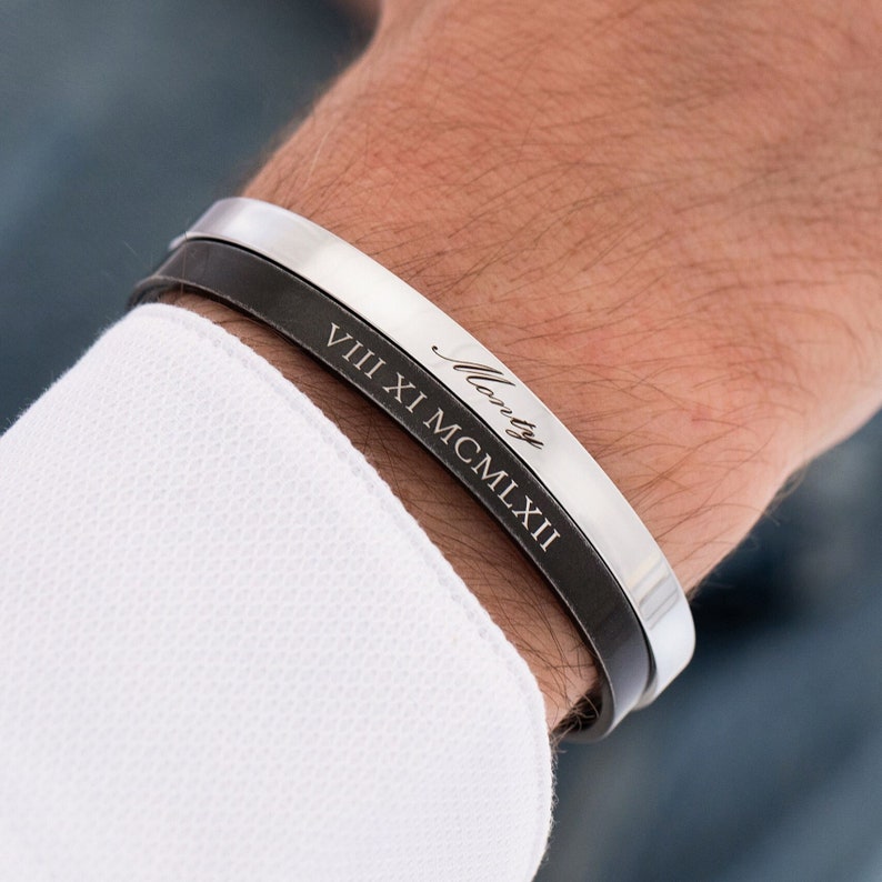 May include: A black leather and silver cuff bracelet with the inscription "Monty VIII XI MCMXLII".