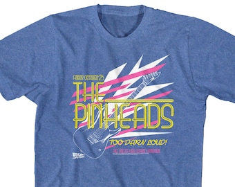 May include: A blue t-shirt with a pink and white graphic of a guitar and the text "The Pinkheads Too Darn Loud!" in yellow.