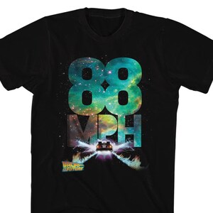 May include: Black t-shirt with a galaxy-themed graphic of the number 88, the words "MPH" and a DeLorean time machine from the movie "Back to the Future".