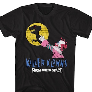 May include: Black t-shirt with a graphic of a clown holding a dinosaur and the text "Killer Klowns From Outer Space."