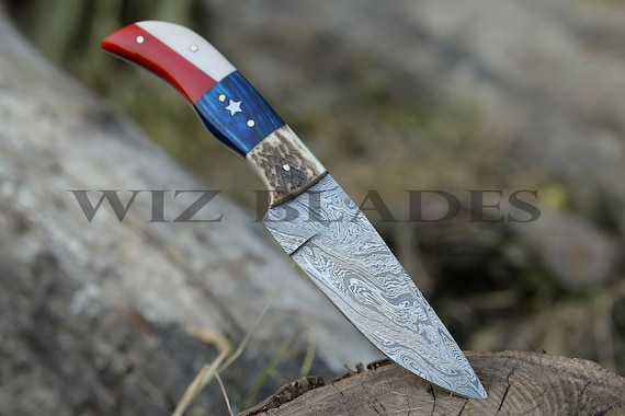 A Texas-shaped Damascus kitchen knife — the state silhouette blade is a genuinely clever and personalized twist that elevates it above generic forged knives.