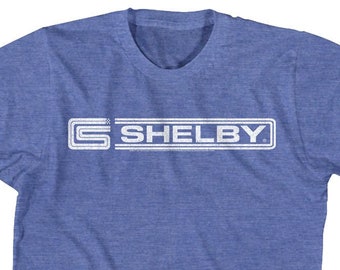 Camisetas azul rey jaspeado con el logotipo de la insignia de Carroll Shelby