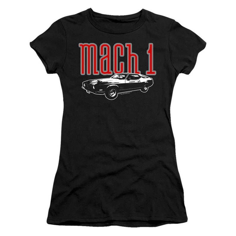 May include: Black t-shirt with a white silhouette of a classic car and the text "mach 1" in red.