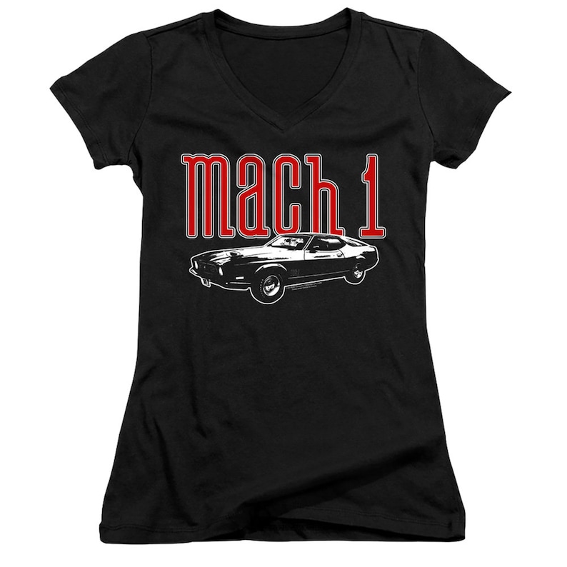 May include: Black v-neck t-shirt with a white silhouette of a classic car and the text "mach 1" in red.