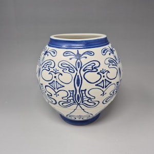 Hand-painted blue and white porcelain vase with floral ceramic decor