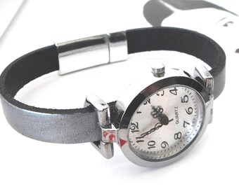 Women's wristwatch, custom-sized leather band, magnetic clasp.