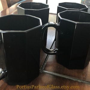 Set of Four “Octime” Black Glass Mugs