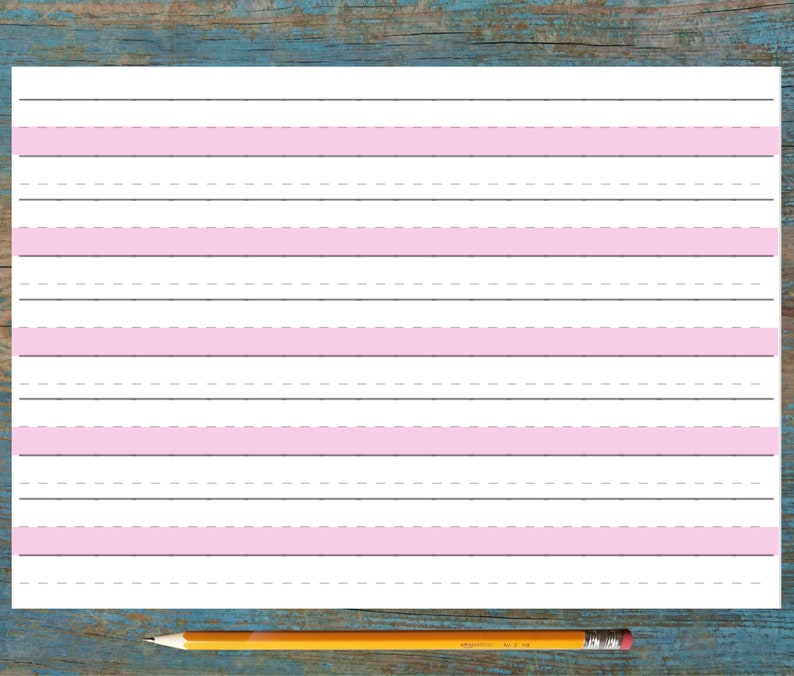 May include: A white sheet of paper with pink lines for writing. The paper is lined with dashed lines and solid pink lines.