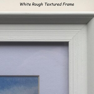 May include: Close-up of a white, textured picture frame with a corner visible. The frame has a rough texture and a simple design. The text "White Rough Textured Frame" is at the top.