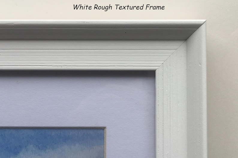 May include: Close-up of a white, textured picture frame with a corner visible. The frame has a rough texture and a simple design. The text "White Rough Textured Frame" is at the top.