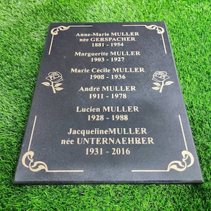 Vertical memorial grave plaque headstone personalized engraved black granite tombstone cemetery outdoor upright in ground graveyard marker