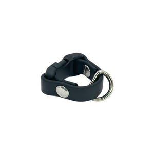 May include: Black rubber ring with a silver metal ring attached. The rubber ring has a small silver button on the side.