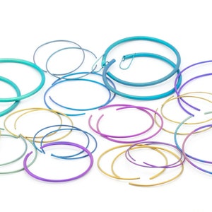Round titanium hoops, available in different sizes and wire thicknesses