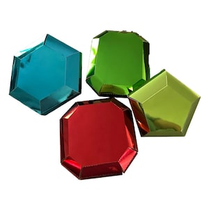 May include: Four colorful, gem-shaped boxes in shades of teal, green, red, and lime green. The boxes have a shiny, metallic finish and are arranged on a white background. The facets of the boxes are clearly defined, giving them a faceted appearance.