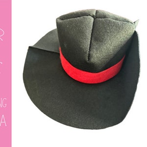 May include: A black felt hat with a wide brim and a red ribbon around the crown.