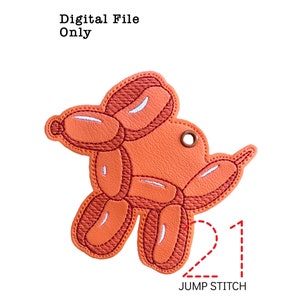 May include: An orange balloon dog design with white highlights and a brown stitched outline. The text "Digital File Only" is at the top, and "21 JUMP STITCH" is at the bottom. The design has a small hole at the top for hanging.