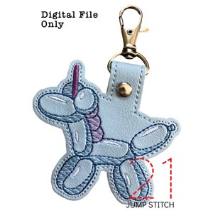 May include: A light blue embroidered keychain shaped like a balloon animal unicorn. The keychain has a gold metal key ring and a jump stitch detail.