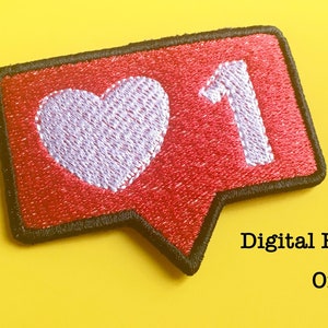 May include: Red and white embroidered patch shaped like a speech bubble with a white heart and the number "1" inside. The patch is surrounded by a black border.