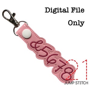 May include: Pink leather keychain with a white button and pink embroidery of the numbers 5678. The keychain has a silver metal ring and a jump stitch detail.