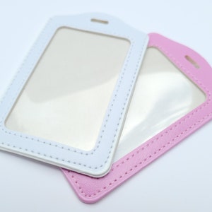 Clean all white or pink carrier for 2-3 cards. Student photo ID, teacher name badge, drivers license, key card. For lanyard / badge reel