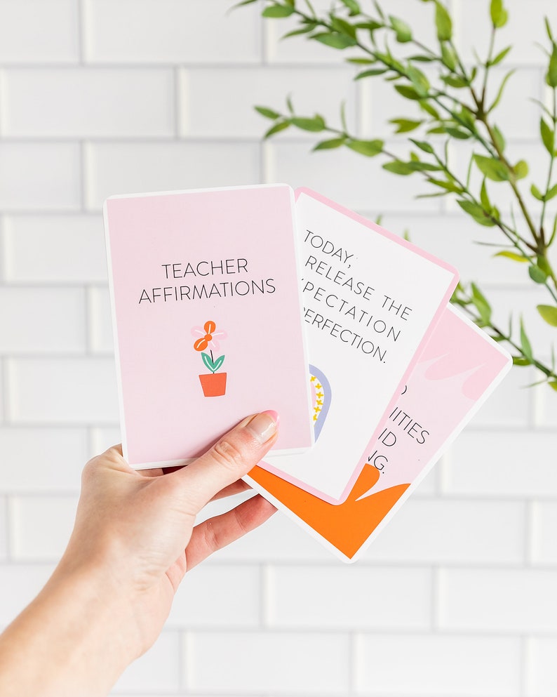 May include: Three pink cards with rounded corners. The top card has a flower illustration and the text "Teacher Affirmations". The middle card has the text "Today, Release the Expectation Perfection.". The bottom card has the text "( ) IITIES ID JG."