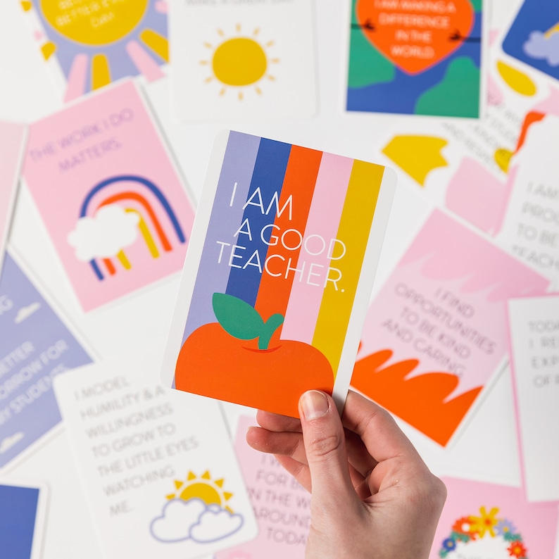 May include: A pink and yellow affirmation card with a rainbow and the text "The work I do matters".