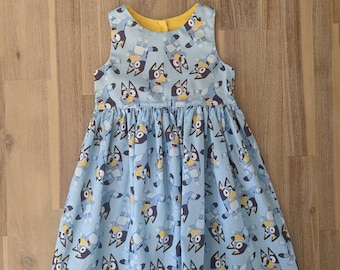 Girls Bluey tea party dress // handmade // cotton // toddler // baby // custom // blue // yellow // frock // bingo // blue heeler // gift