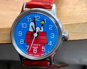 Montre mécanique vintage SCHULZ Snoopy Timex pour femme