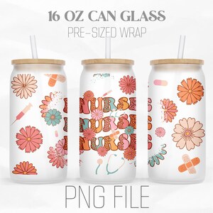May include: A white 16 oz can glass with a pre-sized wrap featuring a floral design and the word "NURSE" in a retro font. The can glass has a wooden lid and a straw.