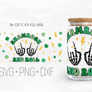 May include: A 16 oz can glass with a green, yellow, and black design that says "Shamrock and Roll" with two skeleton hands making the rock and roll hand gesture.