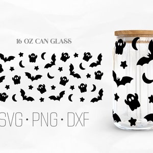 May include: A 16 oz glass jar with a wooden lid, featuring a black and white Halloween themed pattern of bats, ghosts, stars, and crescent moons. The text "SVG. PNG. DXF" is printed below the jar.