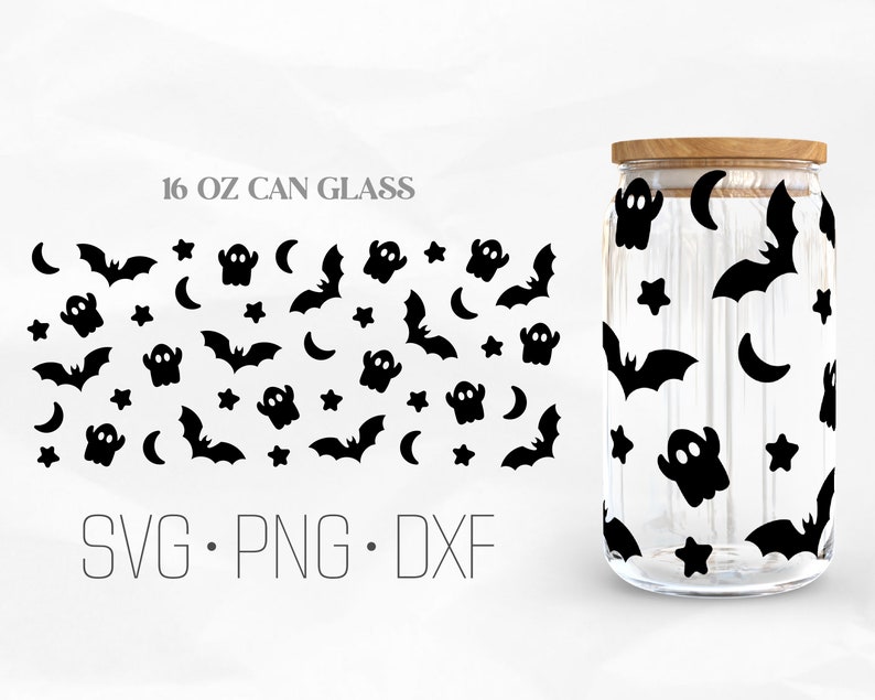 May include: A 16 oz glass jar with a wooden lid, featuring a black and white Halloween themed pattern of bats, ghosts, stars, and crescent moons. The text "SVG. PNG. DXF" is printed below the jar.