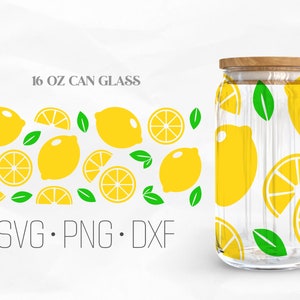 May include: A 16 oz can glass with a lemon pattern. The glass has a clear body and a wooden lid. The pattern includes yellow lemons, green leaves, and lemon slices. The text "SVG. PNG. DXF" is at the bottom of the image.