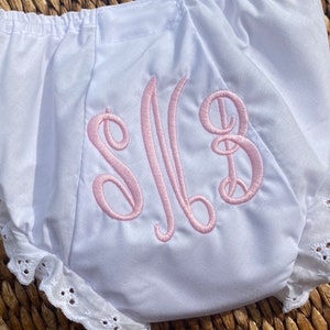 May include: A handmade wooden sign with the text "Welcome" in a playful font. The sign features a distressed white background and a dark brown frame, perfect for a front door or entryway. The sign measures approximately 12 inches wide and 6 inches tall.