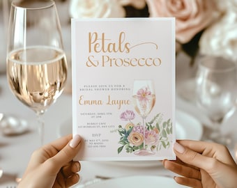 May include: A bridal shower invitation with the text "Petals & Prosecco" in gold script. The invitation features a floral illustration and details for Emma Layne's shower, including the date, time, and location.