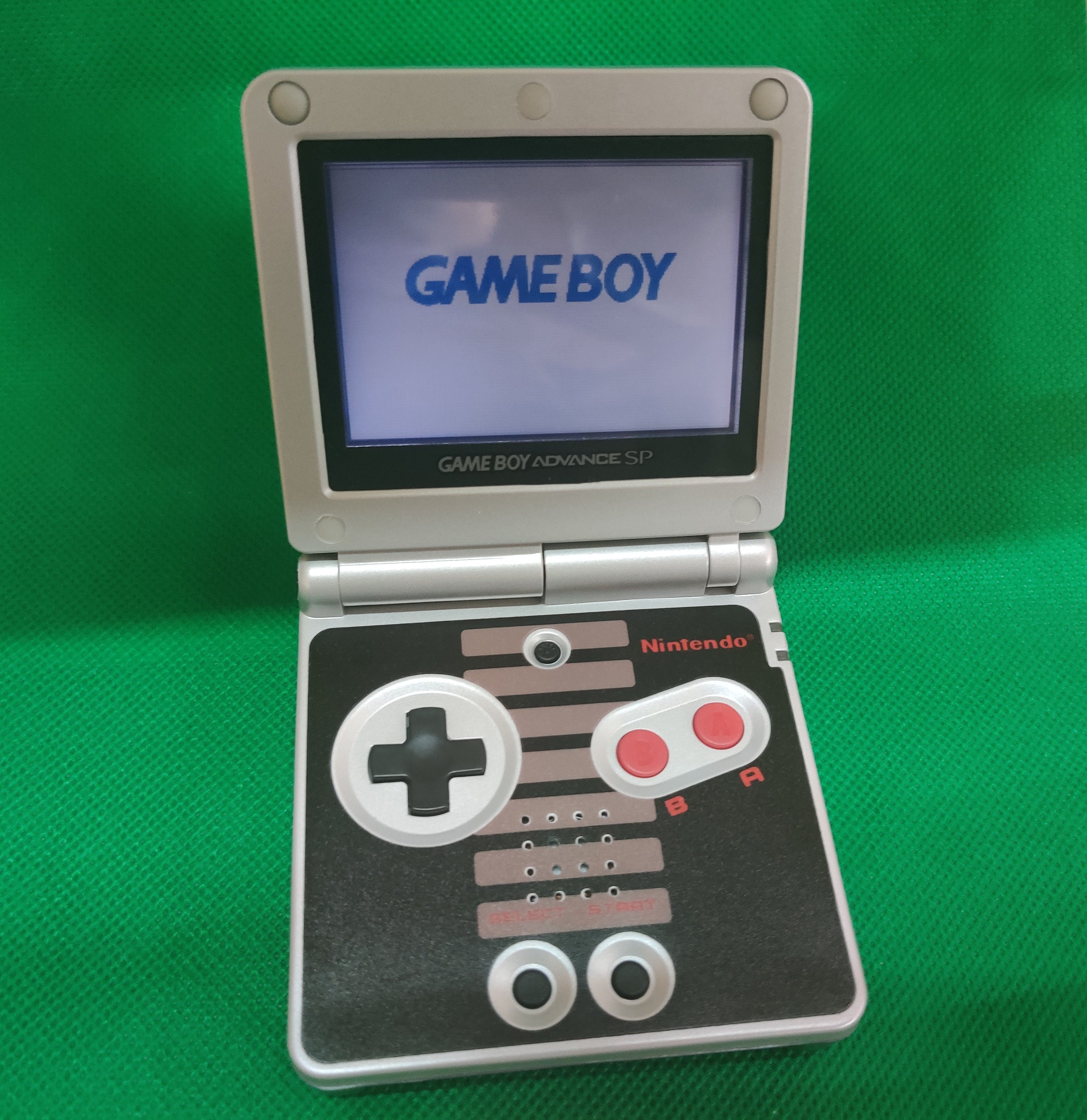 Nintendo Gameboy Advance SP AGS 001 Nes Edition handheld custom console  with 10 level brightness adjustment.