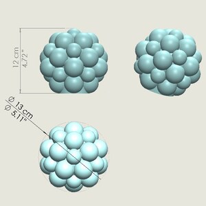 May include: A cluster of 20 light blue spheres, arranged in a spherical shape, with a diameter of 5.1 inches. The cluster is shown from three different angles.