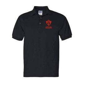 May include: A black polo shirt with a red logo on the left chest. The logo is a shield with a stylized letter "A" inside and the word "atlas" below it.