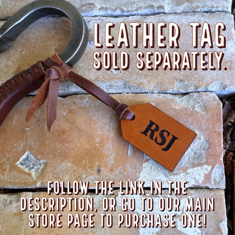 May include: A brown leather tag with the initials "RSJ" embossed in black. The tag is attached to a brown leather strap and is hanging from a metal hook. The text "LEATHER TAG SOLD SEPARATELY." is displayed above the tag. The text "FOLLOW THE LINK IN THE DESCRIPTION, OR GO TO OUR MAIN STORE PAGE TO PURCHASE ONE!" is displayed below the tag.